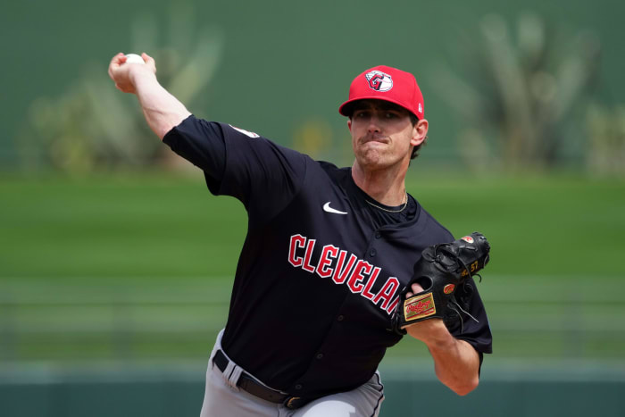 Mar 12, 2024; Surprise, Arizona, USA; Cleveland Guardians starting pitcher Shane Bieber (57) pitches against the Texas Rangers during the first inning at Surprise Stadium.